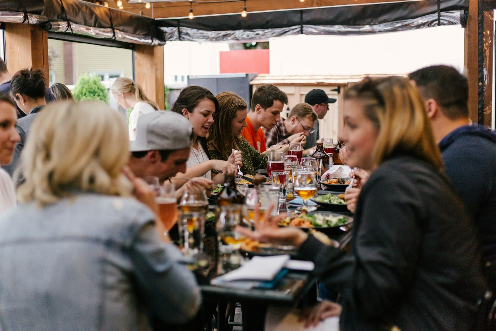 Guests sharing a meal around a long table
